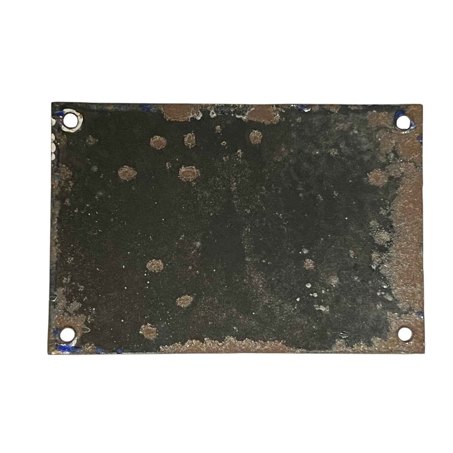 Rust-covered metal plate with four holes on a white background
