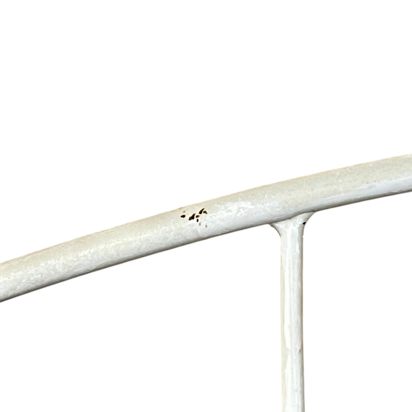 Close-up of a metal she with visible wear and tear on a white background