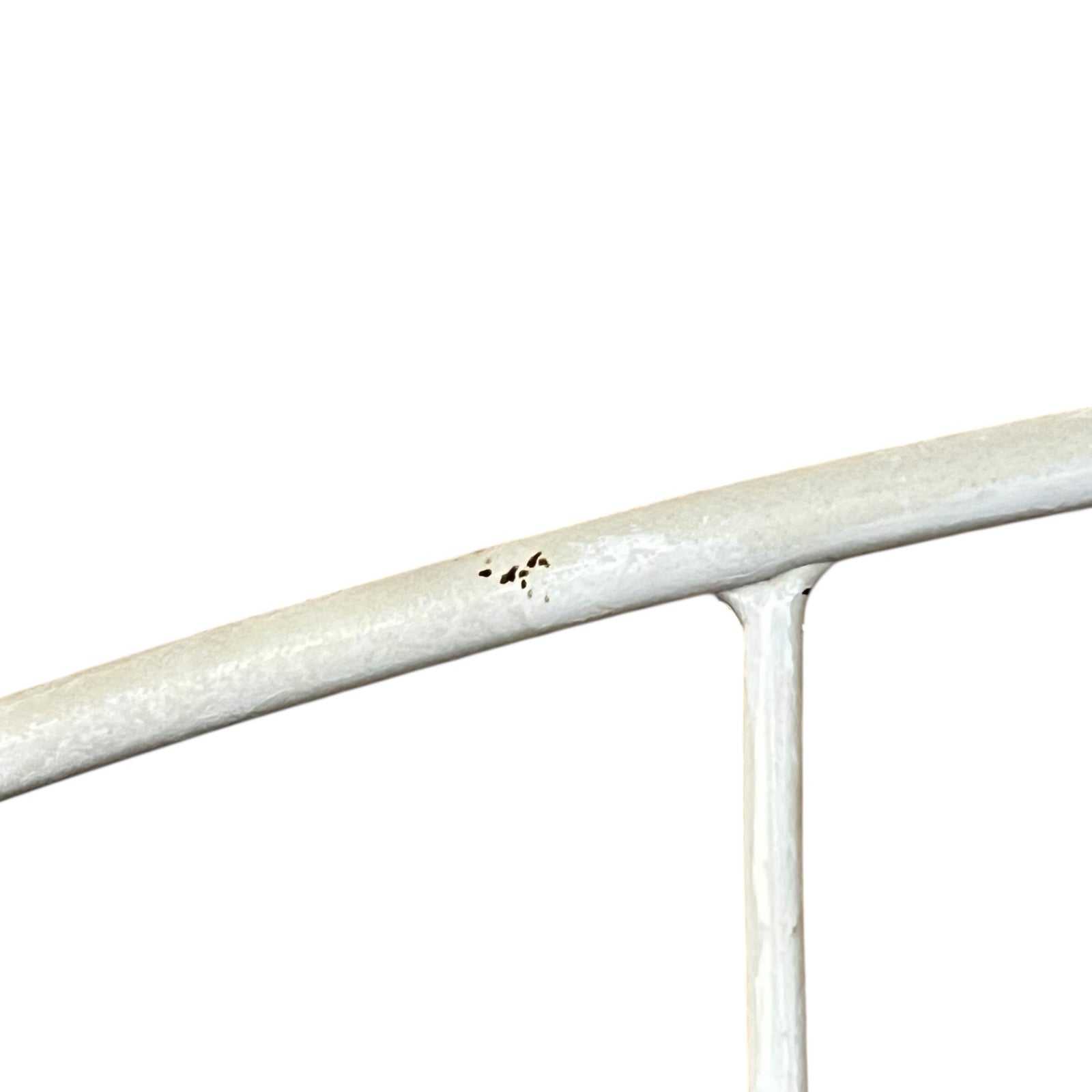 Close-up of a metal she with visible wear and tear on a white background