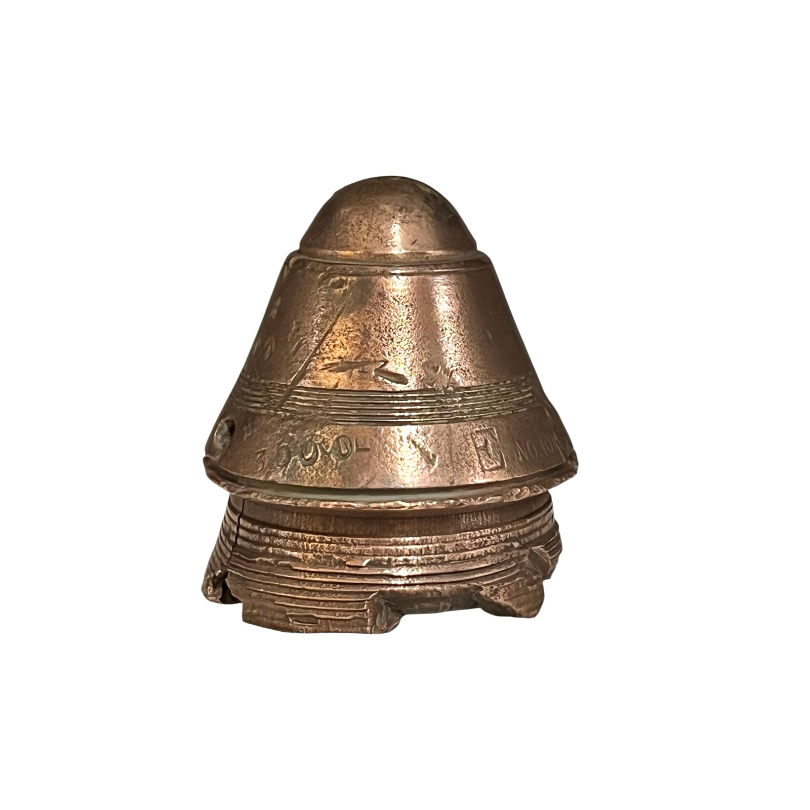 WW1 brass fuse paperweight on a white background 