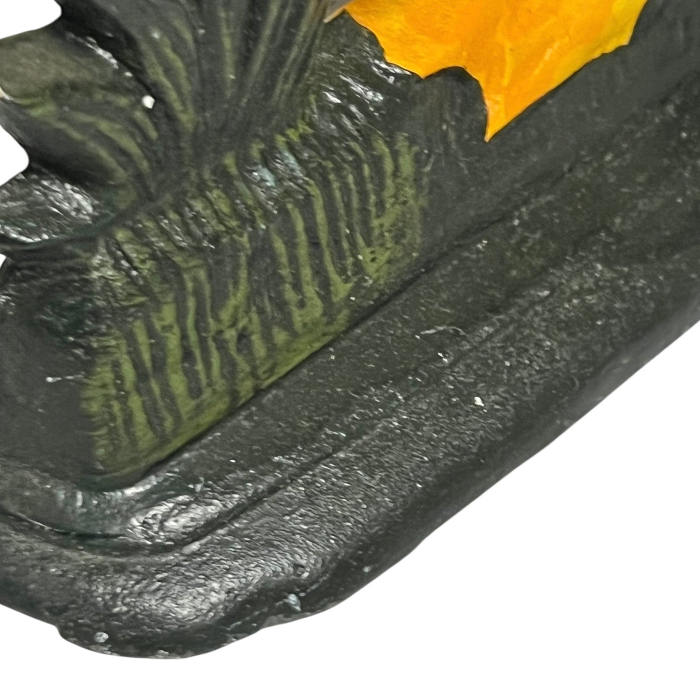Close up of cast iron doorstop on a white background