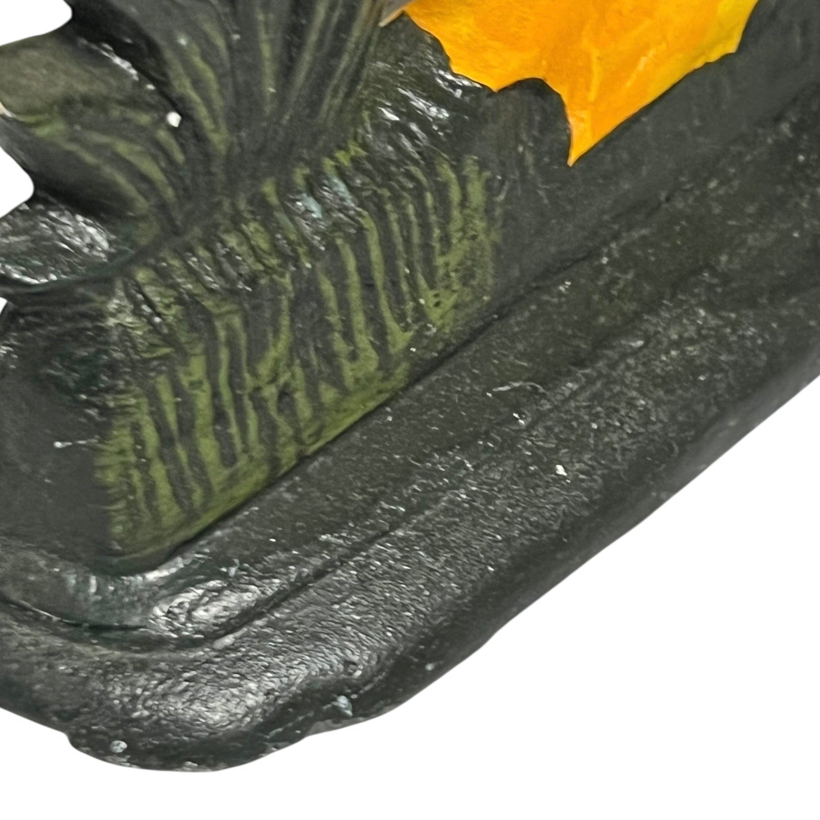Close up of cast iron doorstop on a white background
