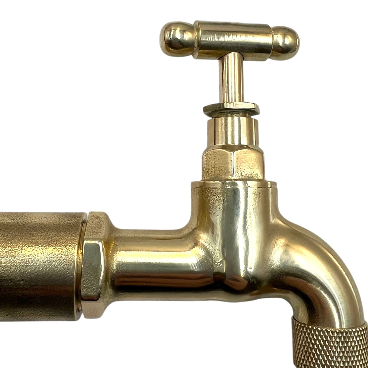 Gold-colored faucet on a white background