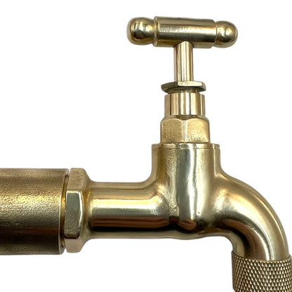 Gold-colored faucet on a white background