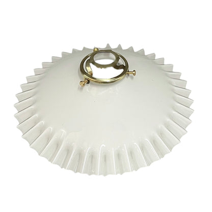 White glass lamp shade with gold metal fixture on a white background