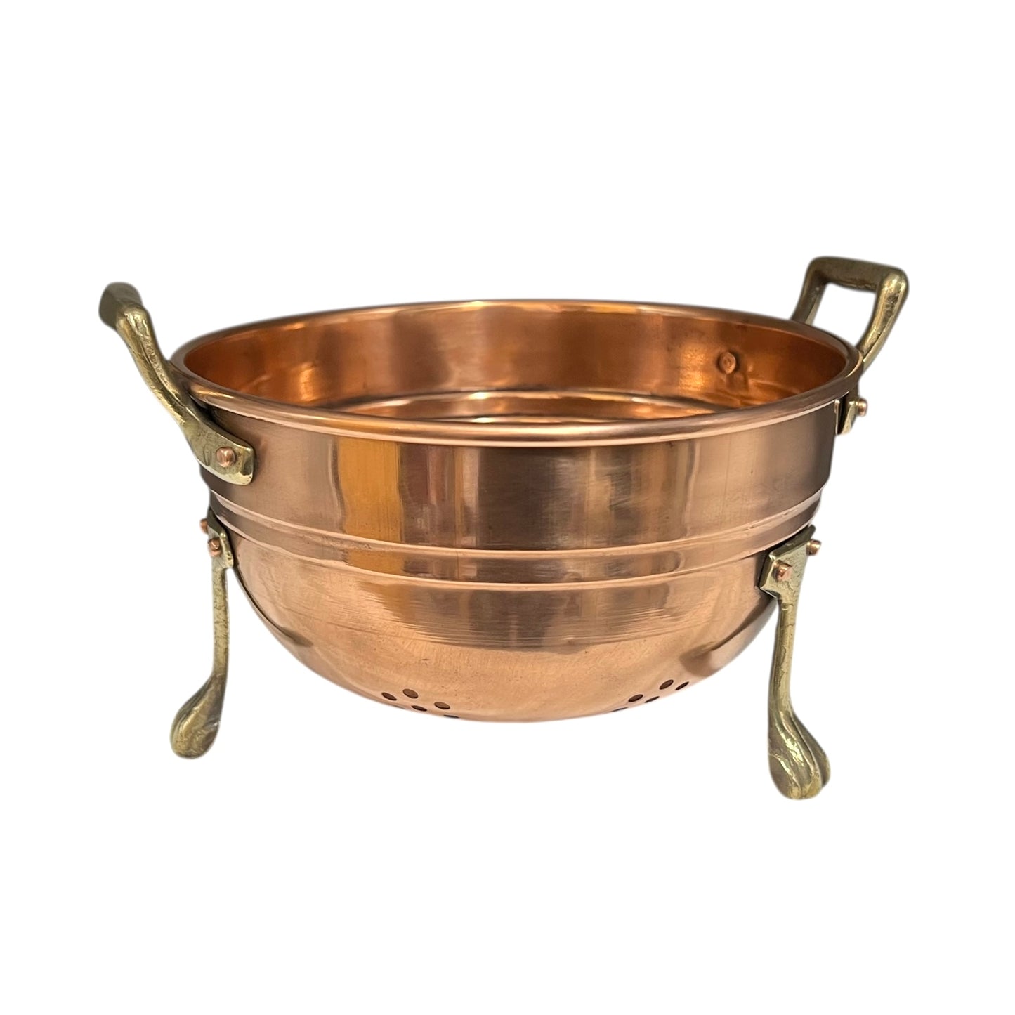 Copper colander with brass handles and feet on a white background