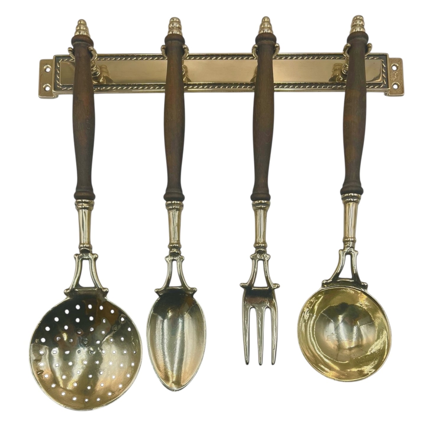 French brass and wooden 4 piece utensil set hanging from a brass bar