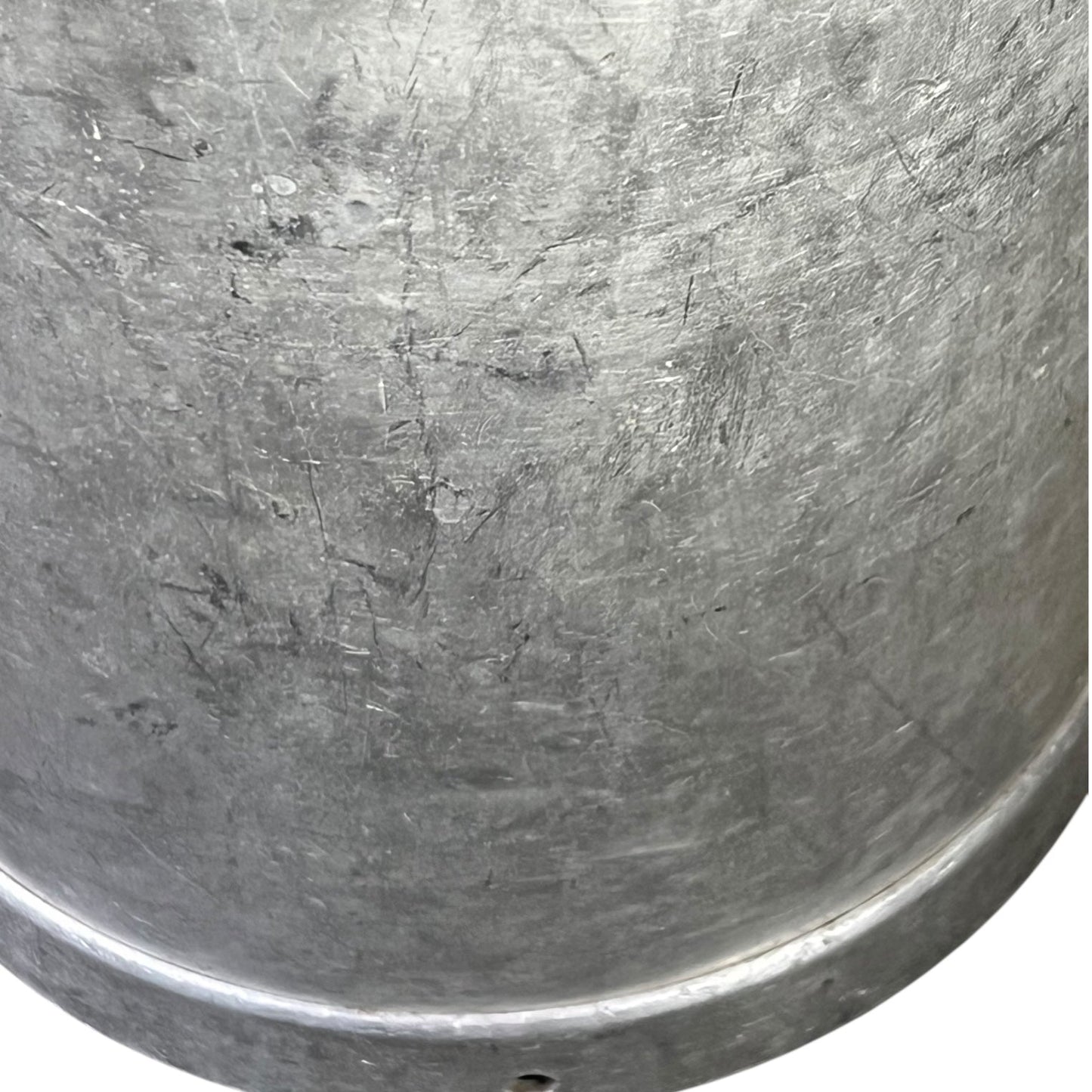 close up of metal milk churn on a white background