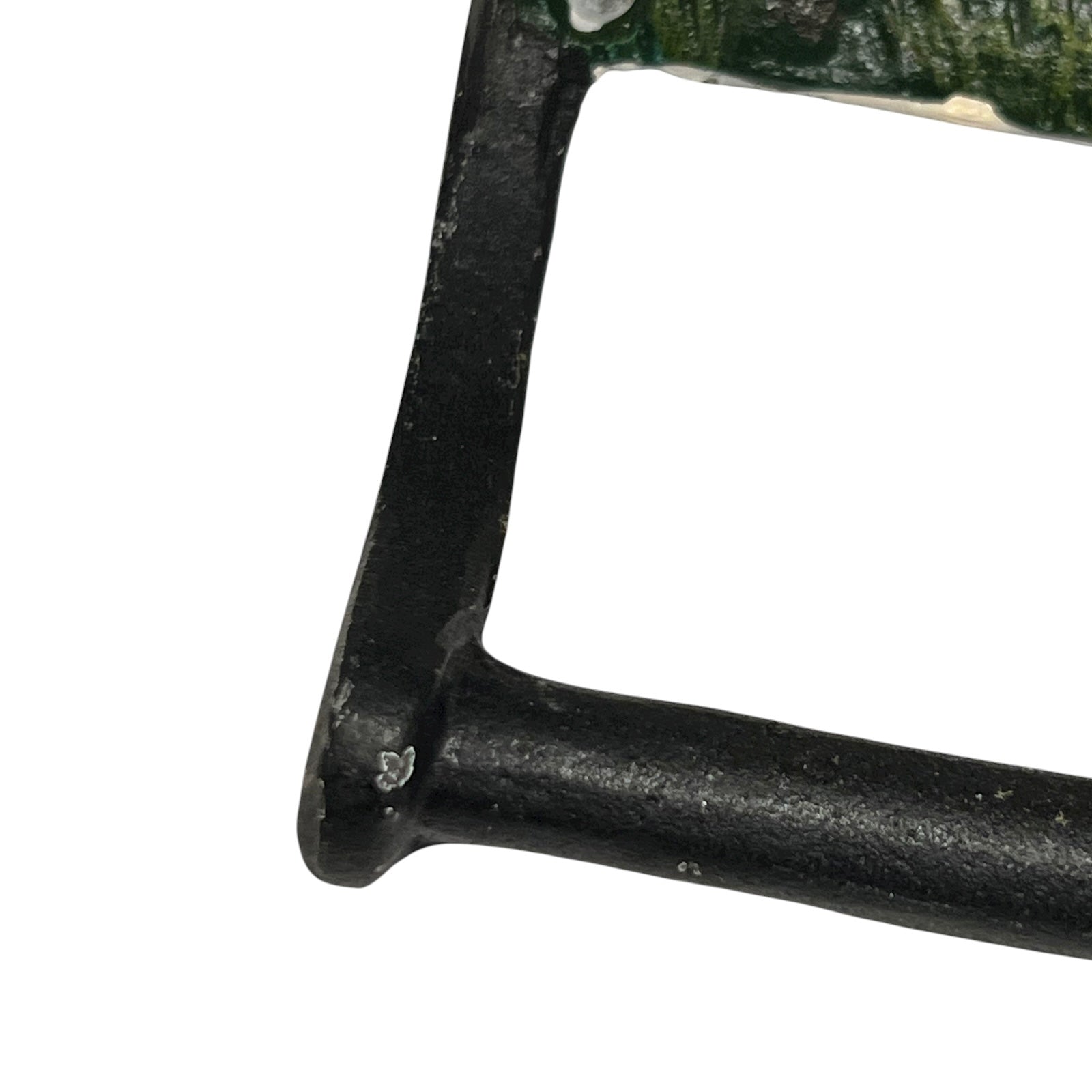 close up of cast iron toiler roll holder on a white background