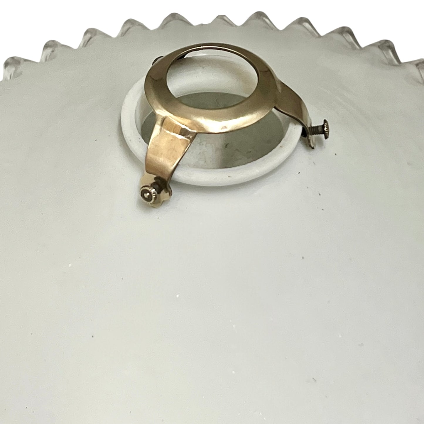 French vintage milk glass opaline lampshade with a clear trimmed frilly edge and a brass bulb holder ideal for a French country style set on a white background