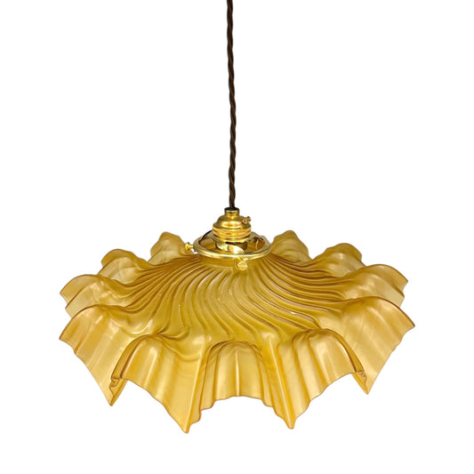 Amber coloured vintage French  pendant light with a scalloped design on a white background