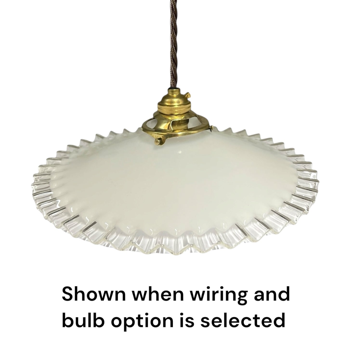 A vintage-style pendant light with a white ribbed glass shade and brass metal fixture, suspended by a dark cord against a white background, with text below reading 'Shown when wiring and bulb option is selected'.