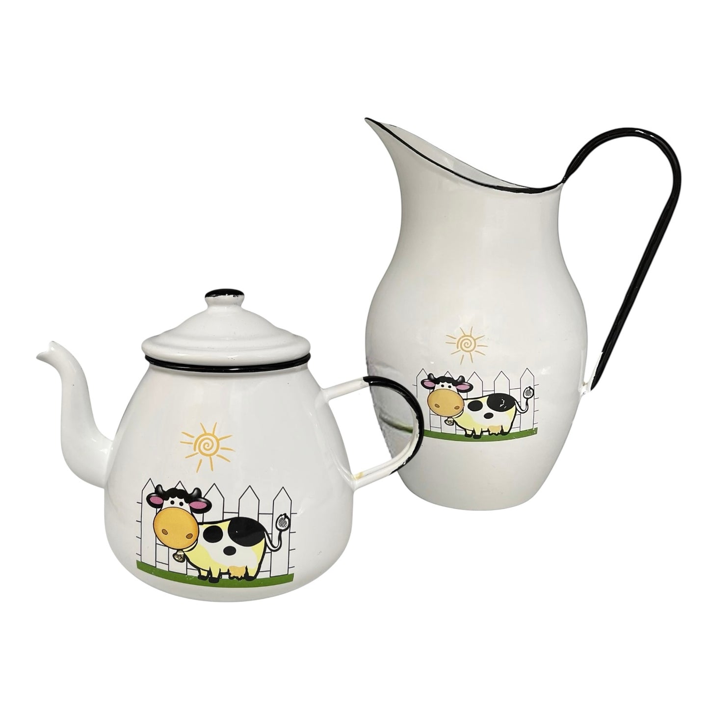 Teapot and pitcher set with cow illustrations on a white background