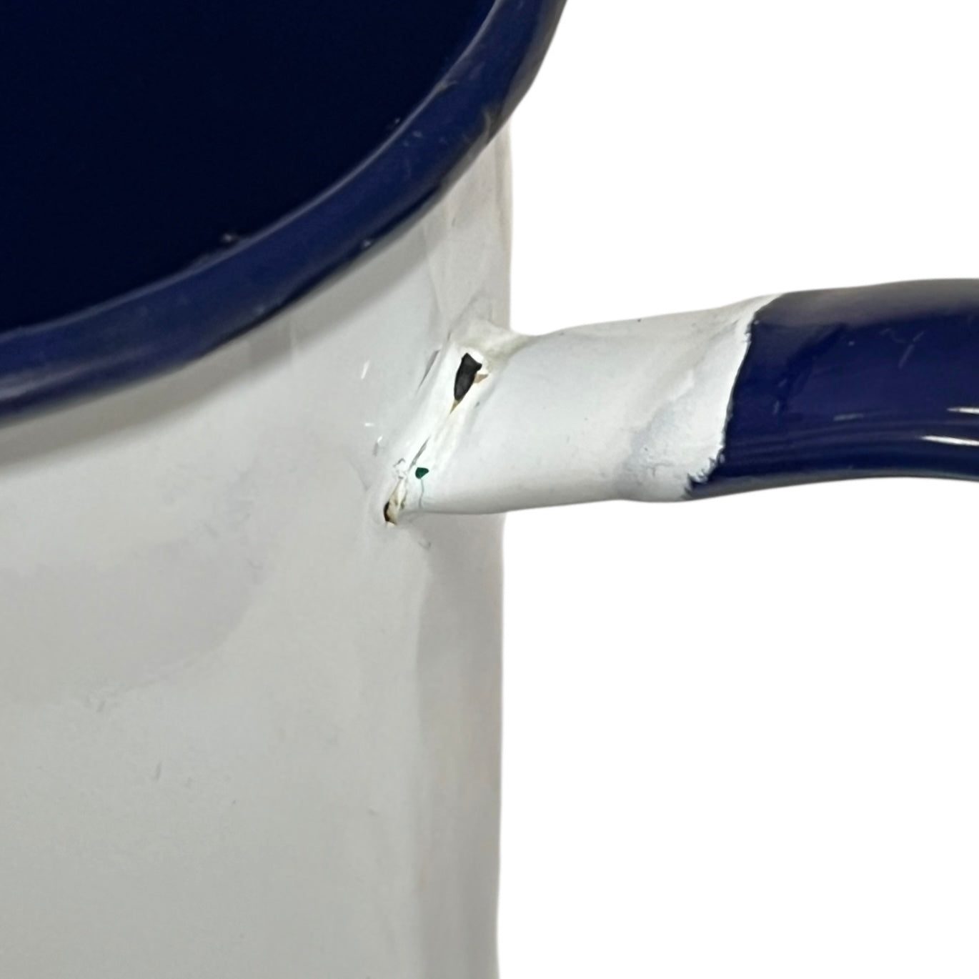 Close up of an enamel coffee pot on a white background