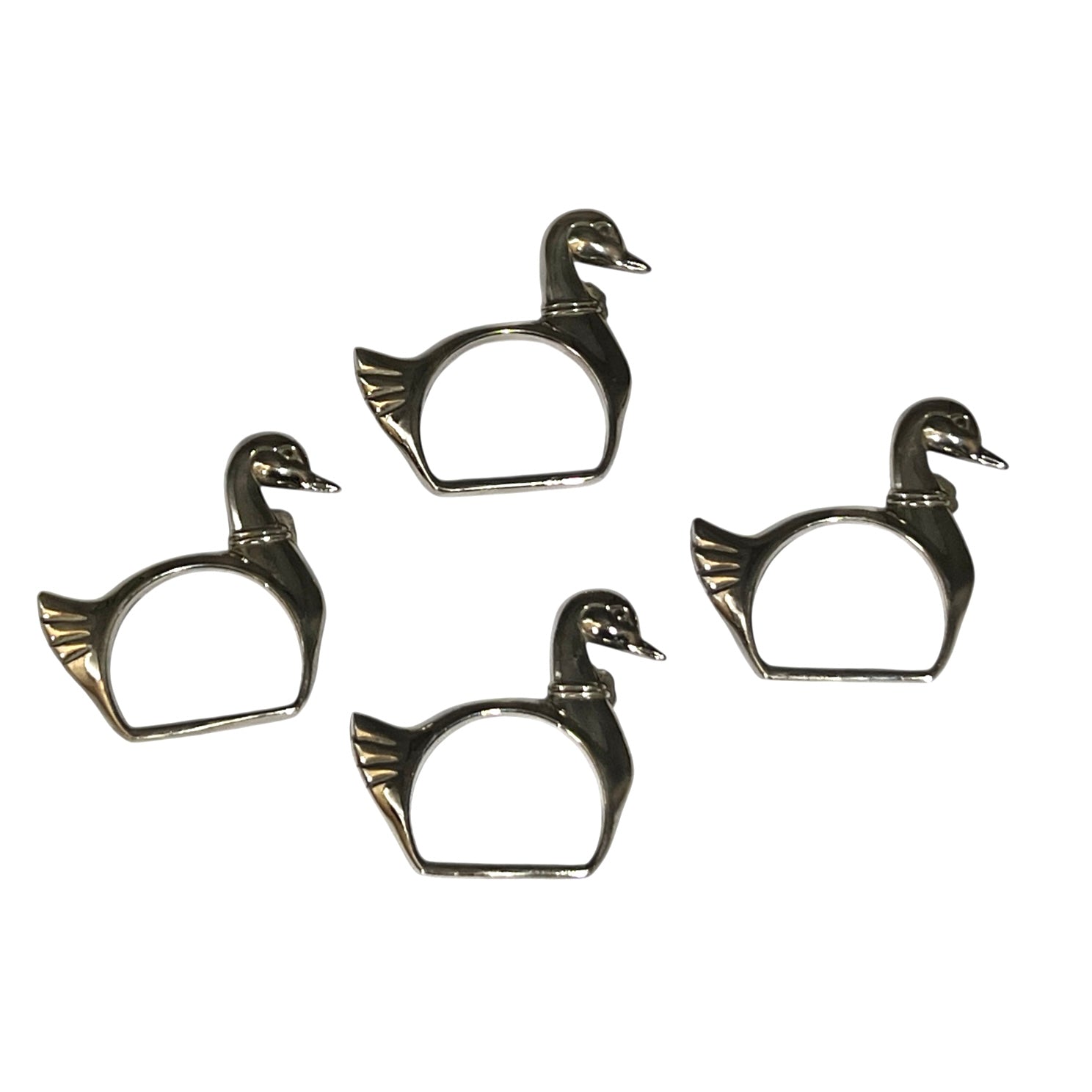Four silver plated swan shaped napkin rings on a white background