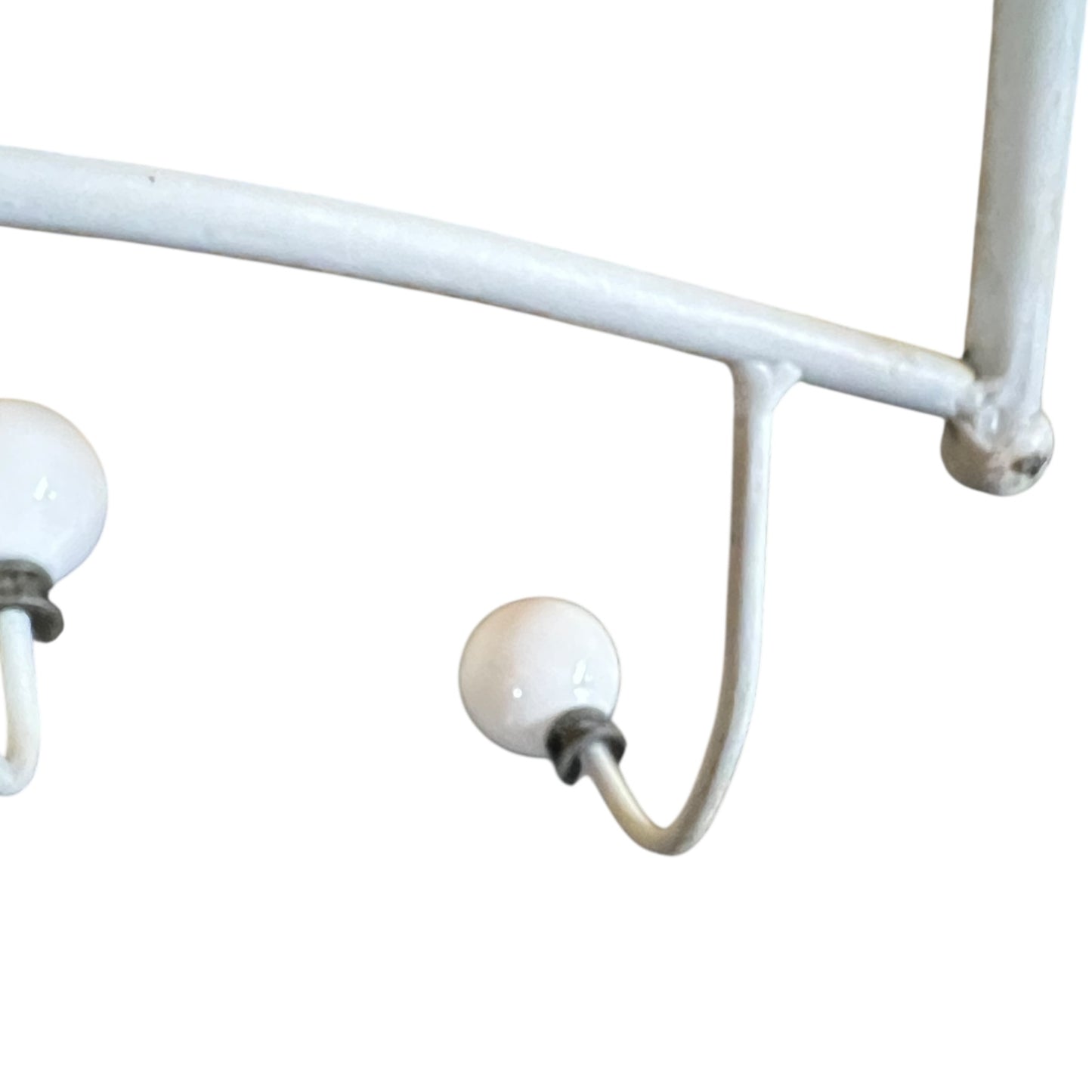 Close-up of a metal she with visible wear and tear on a white background