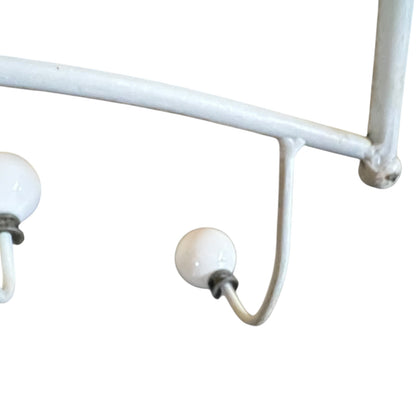 Close-up of a metal she with visible wear and tear on a white background