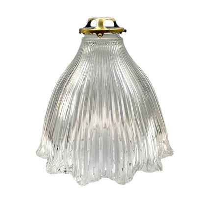 Clear ribbed glass pendant light with brass fitting on a white background