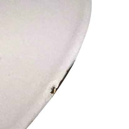 Close up of a Le Creuset pot on a white background