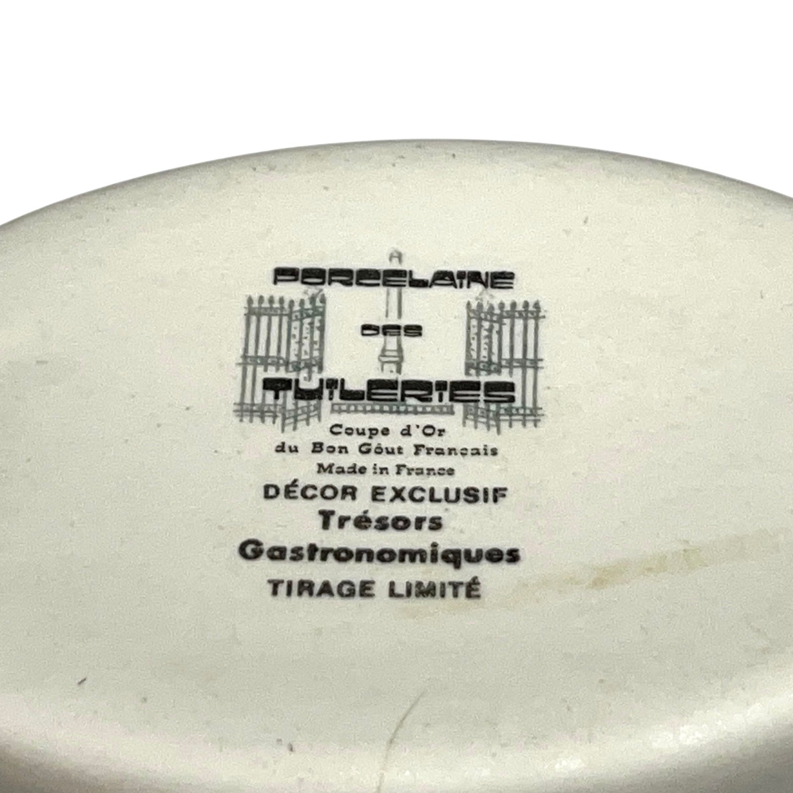 Ceramic ramekin with branding and text on a white background