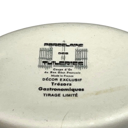 Ceramic ramekin with branding and text on a white background