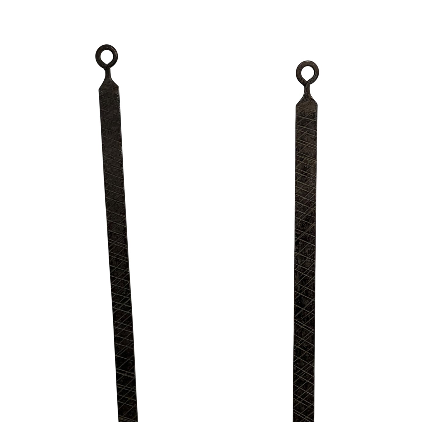 Close up of French copper kitchen utensils with black handles on a white background