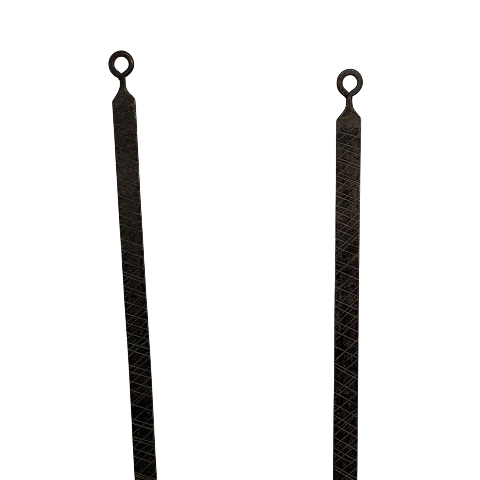 Close up of French copper kitchen utensils with black handles on a white background