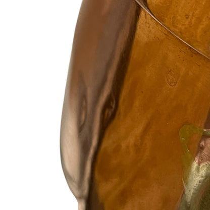 Close up of a copper cooking pot stockpot with handles on a white background