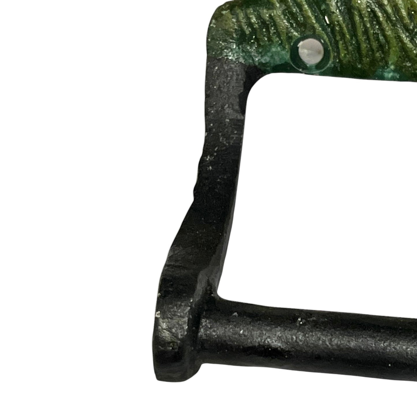 Close-up of a rustic metal toilet roll holder with a textured green top section and a black vertical side, shown against a plain white background.