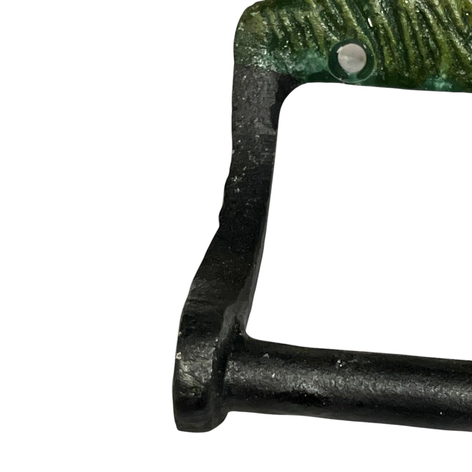 Close-up of a rustic metal toilet roll holder with a textured green top section and a black vertical side, shown against a plain white background.