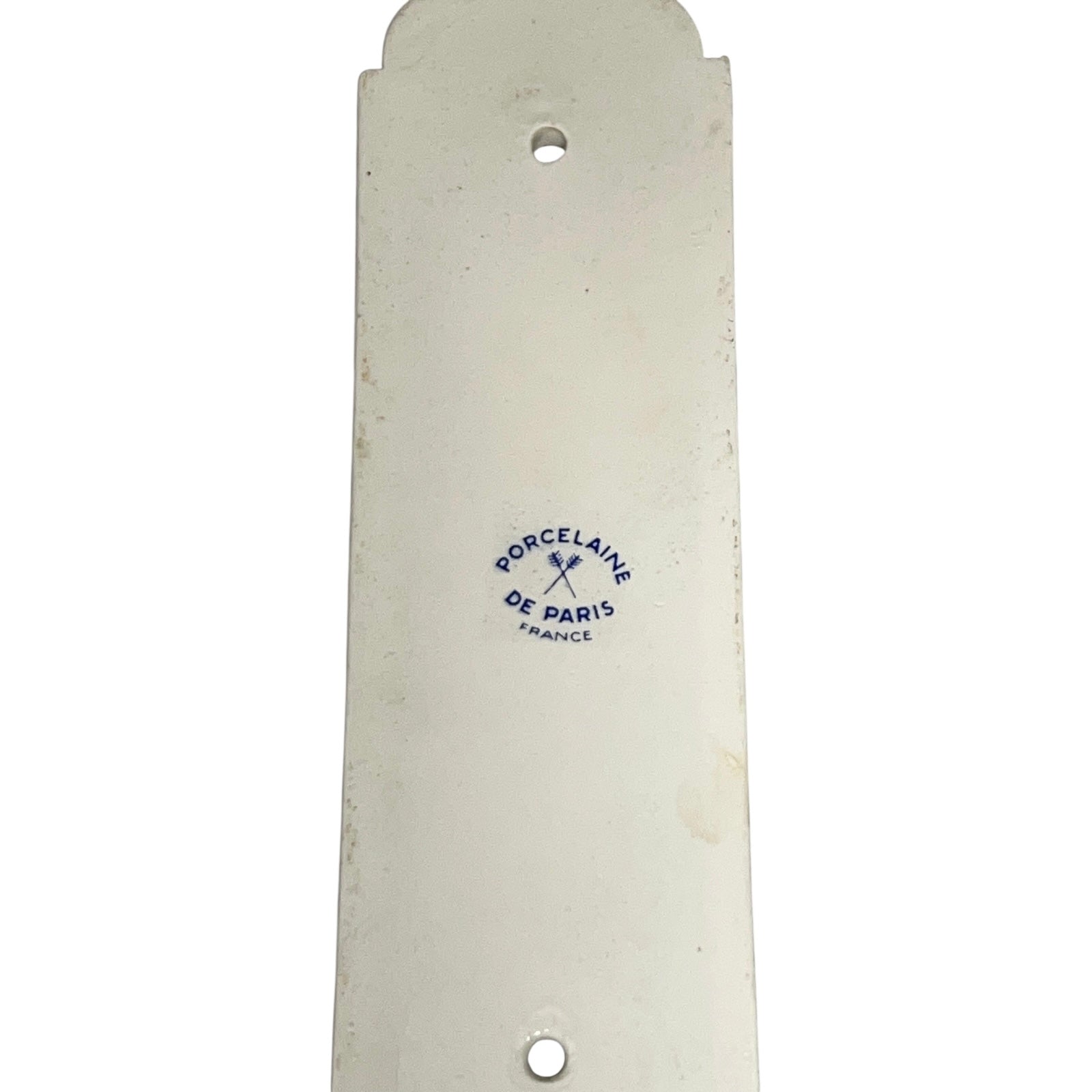 Close up of the back of a finger push plates on a white background