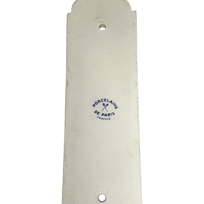Close up of the back of a finger push plates on a white background
