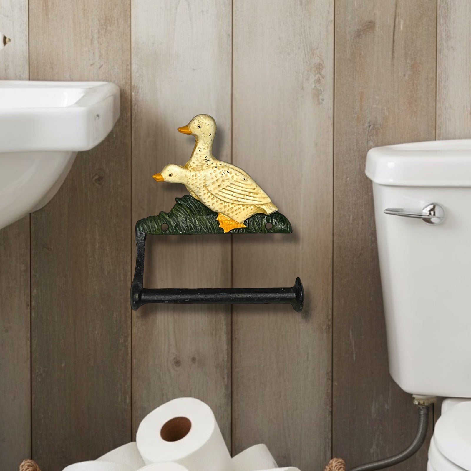 Decorative toilet paper holder shaped like a goose in a bathroom setting.