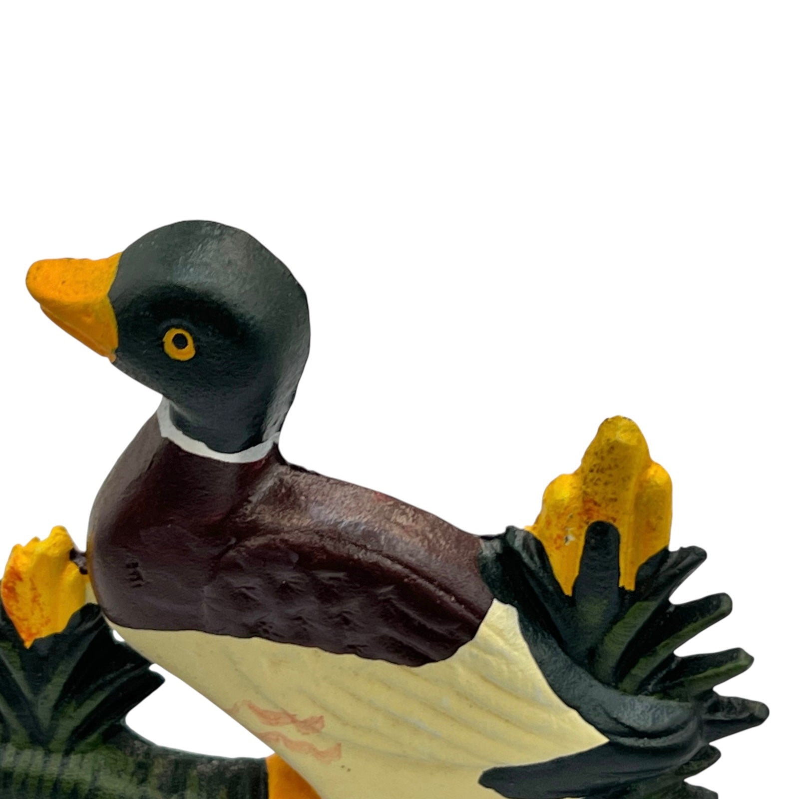 Close up of duck doorstop on a decorative stand with a white background