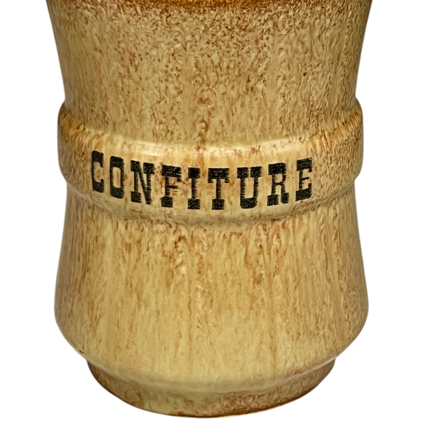 Ceramic jar with 'CONFITURE' text on a white background