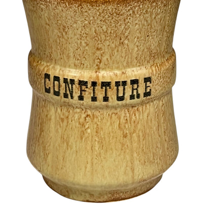 Ceramic jar with 'CONFITURE' text on a white background