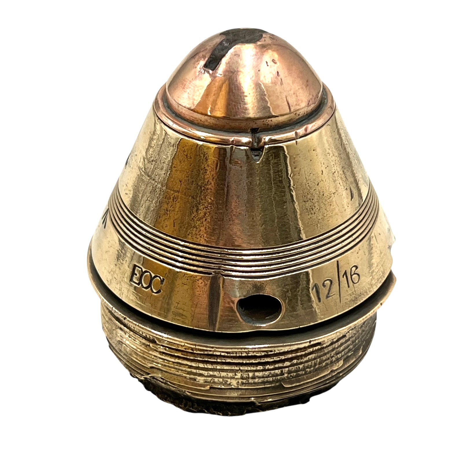 Polished British brass WW1 fuse or paperweight type 101 on a white background