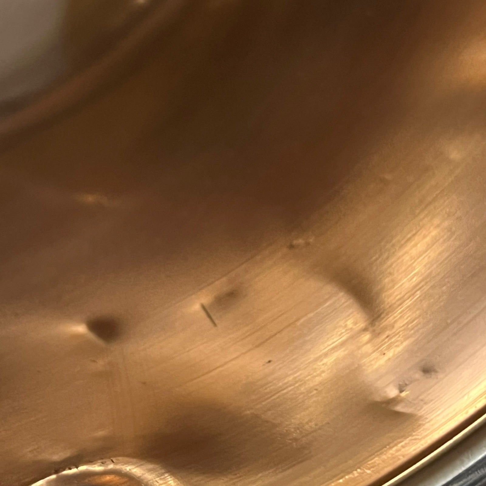 Close up of a French copper bathroom basin on a white background