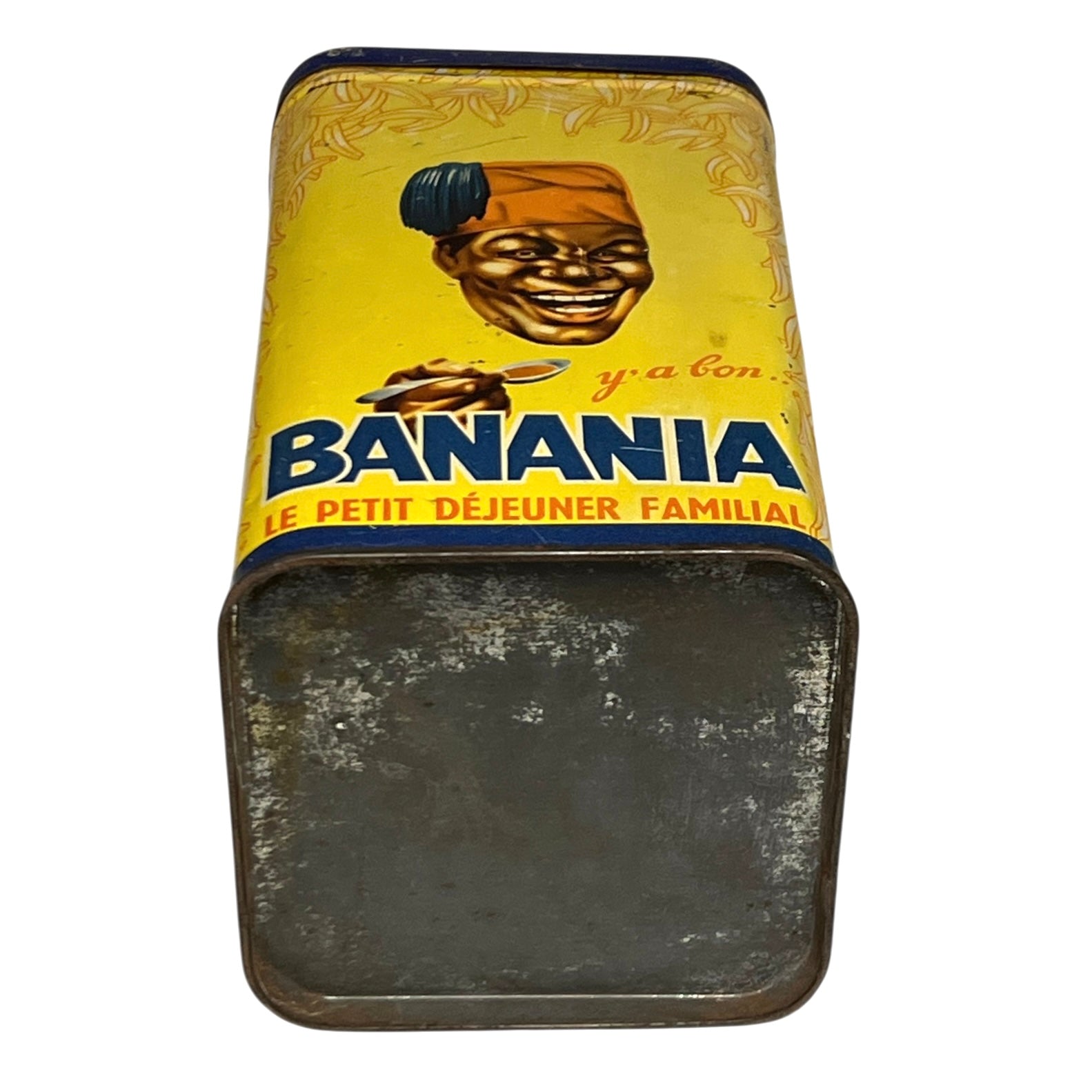 Vintage 'Banania' metal lunch box with yellow label and black handle.