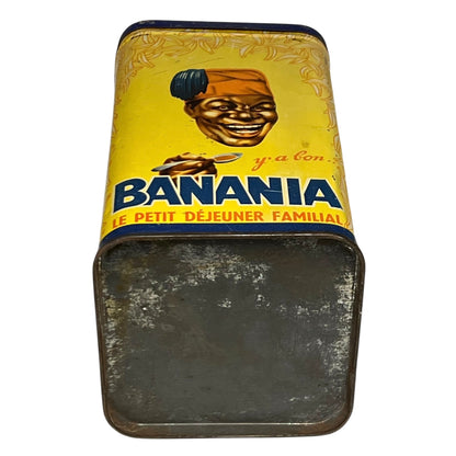 Vintage 'Banania' metal lunch box with yellow label and black handle.