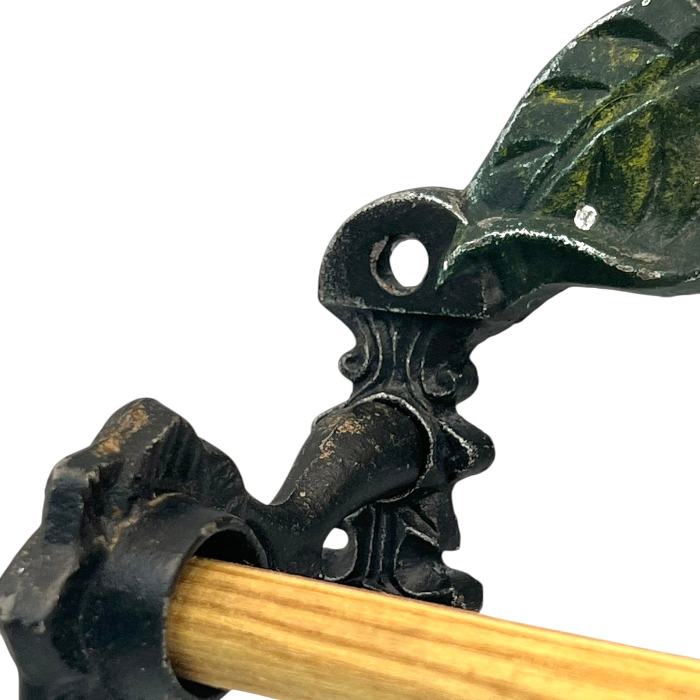 close up of a cast iron kitchen roll holder on a white background 