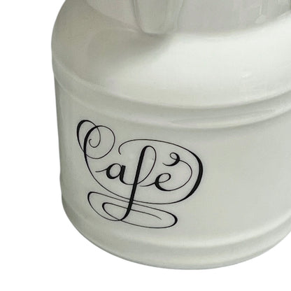 White ceramic container with 'Cafe' text on a white background