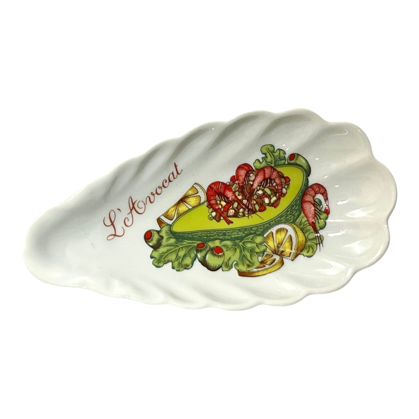 shell-shaped porcelain avocado dishes  decorative designs and 'L'Avocat' branding on a white background.
