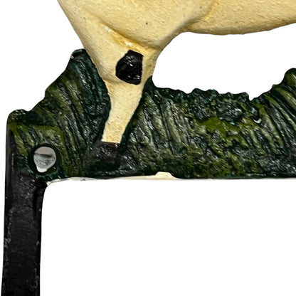 close up of cast iron toiler roll holder on a white background