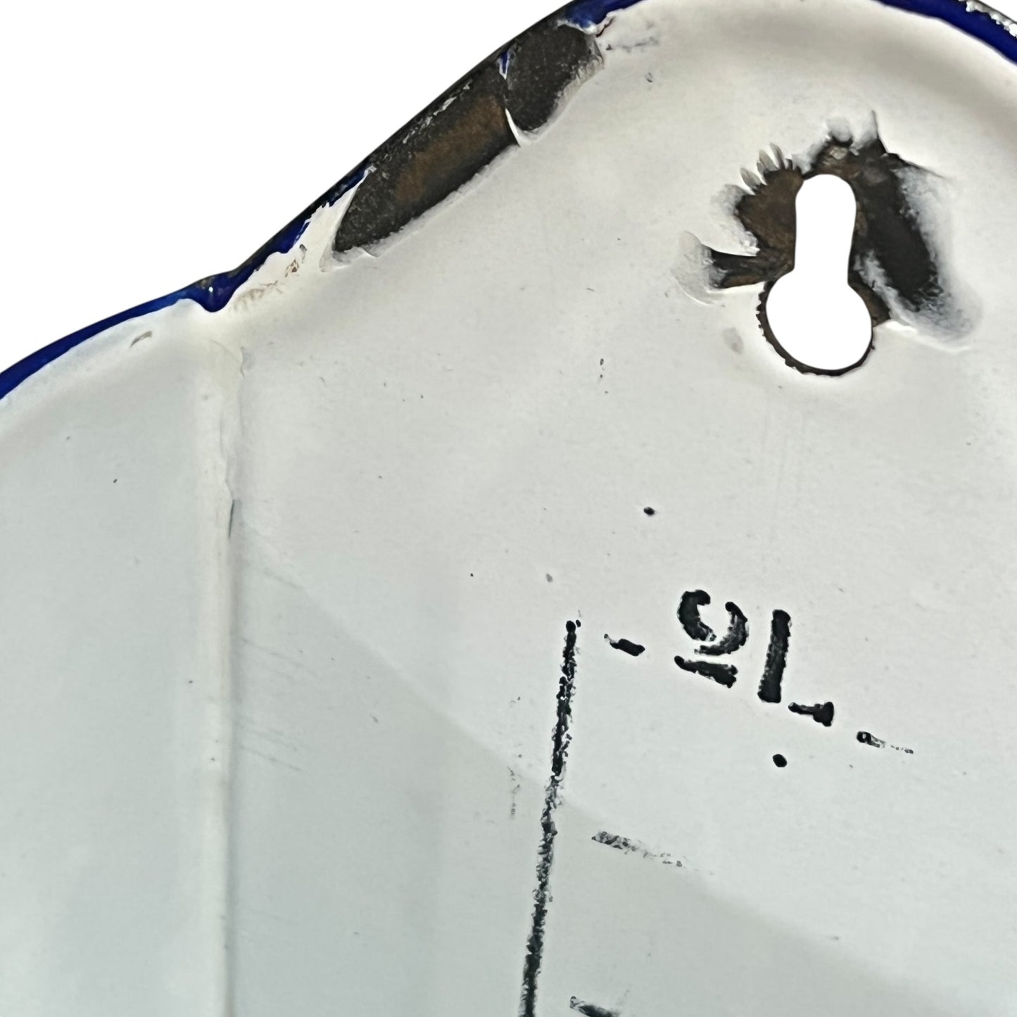 Close up of  French vintage enamel planter with a flat back and a spout on a white background