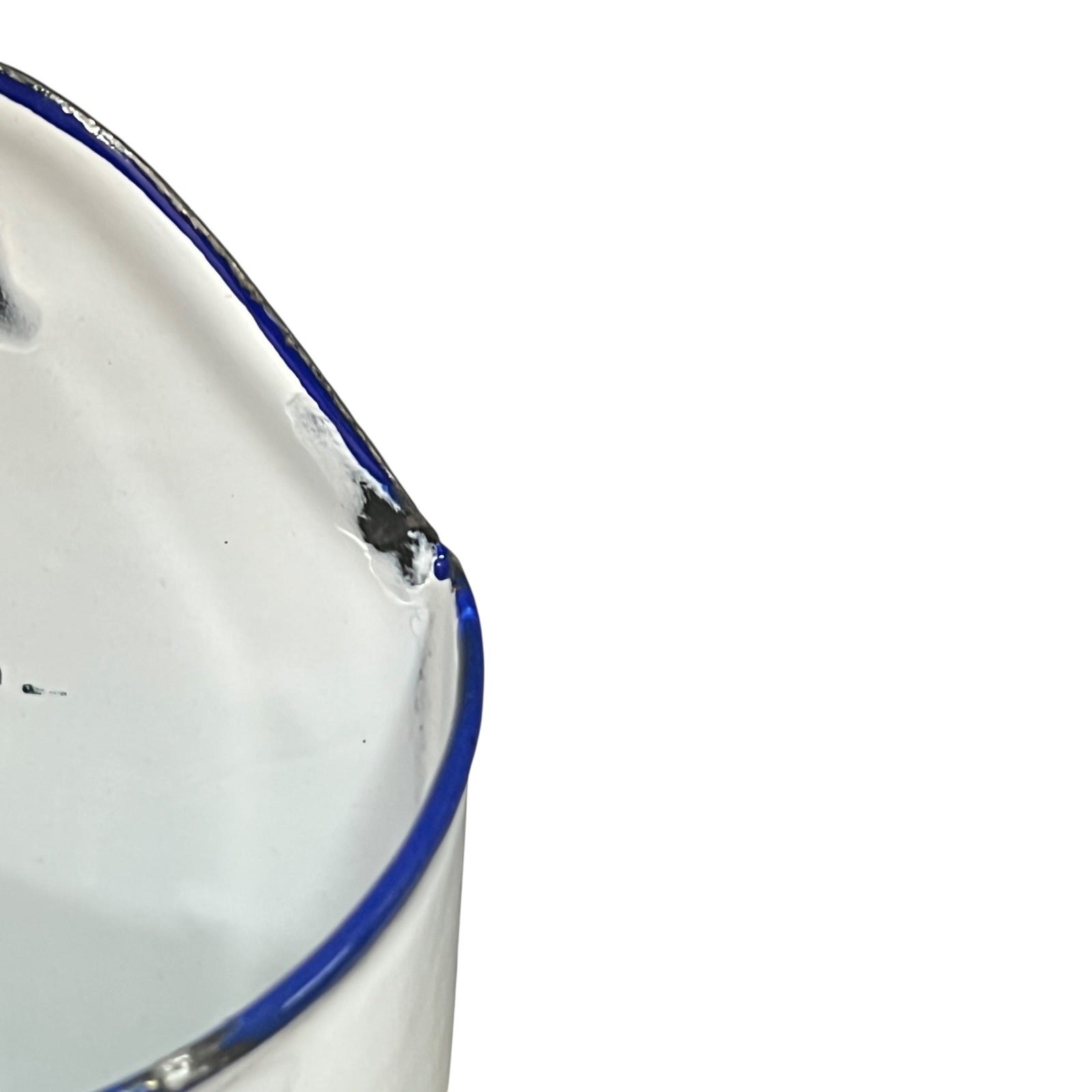 Close up of  French vintage enamel planter with a flat back and a spout on a white background