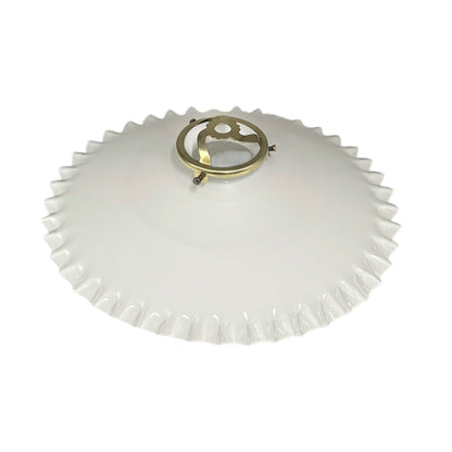 White lampshade with gold fixture on a white background
