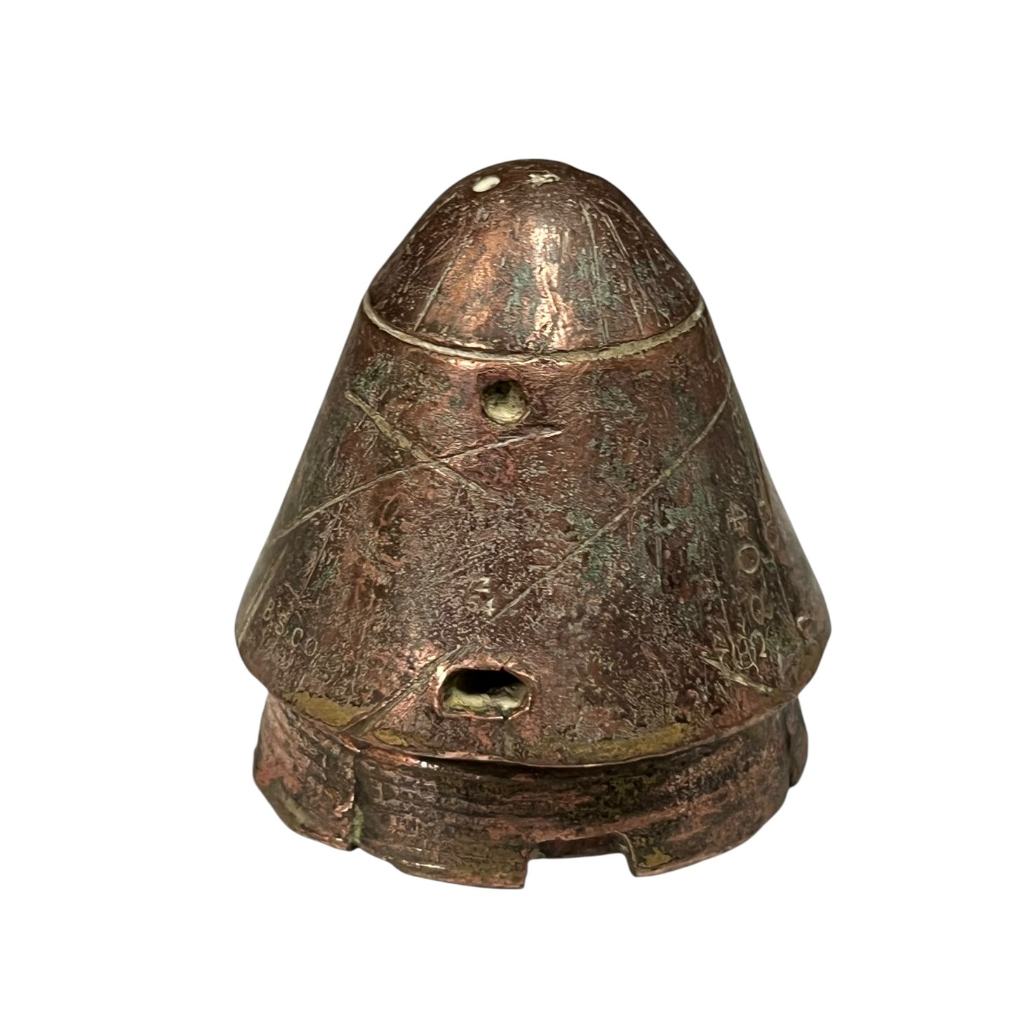 WW1 British brass fuse now repurposed as a paperweight on a white background