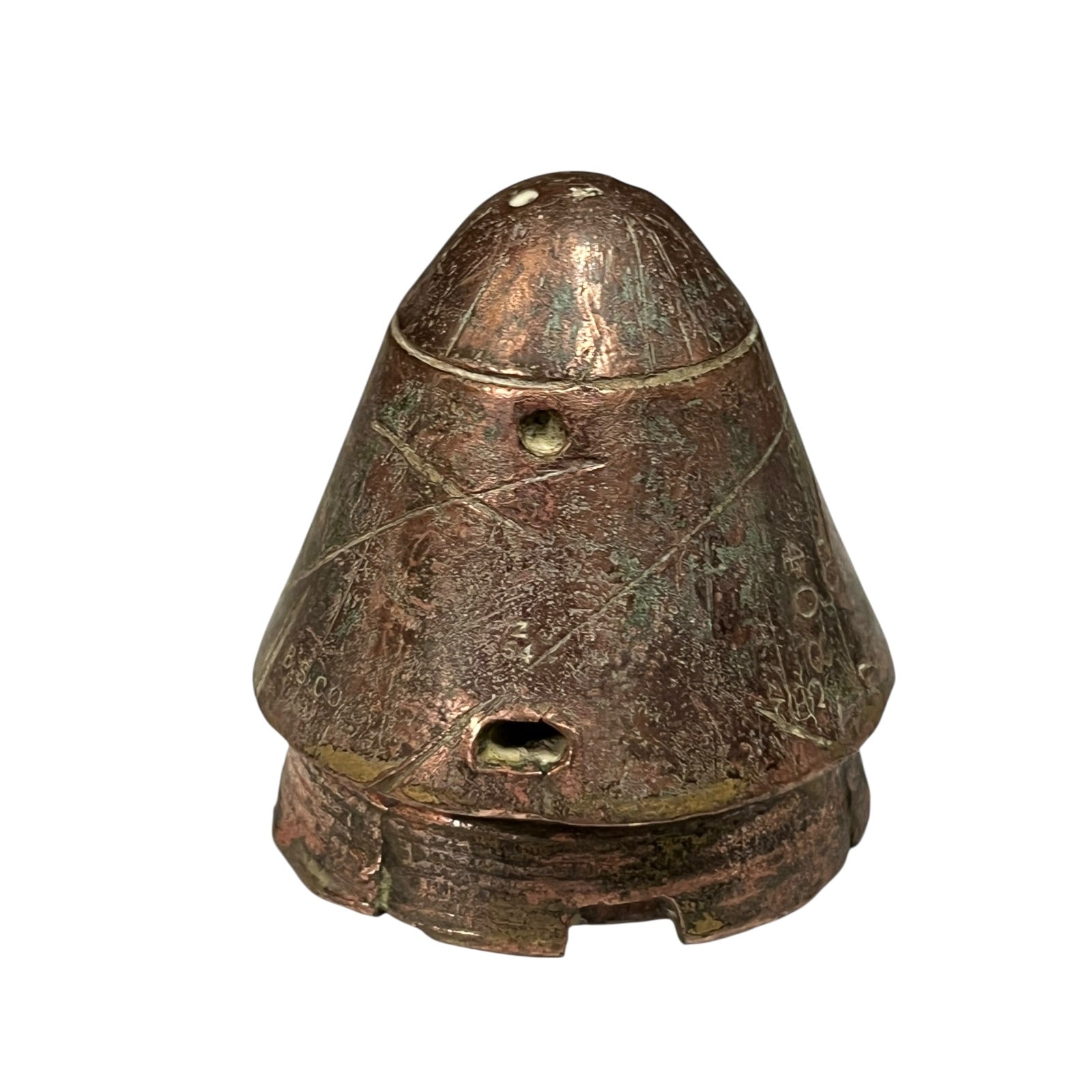 WW1 British brass fuse now repurposed as a paperweight on a white background