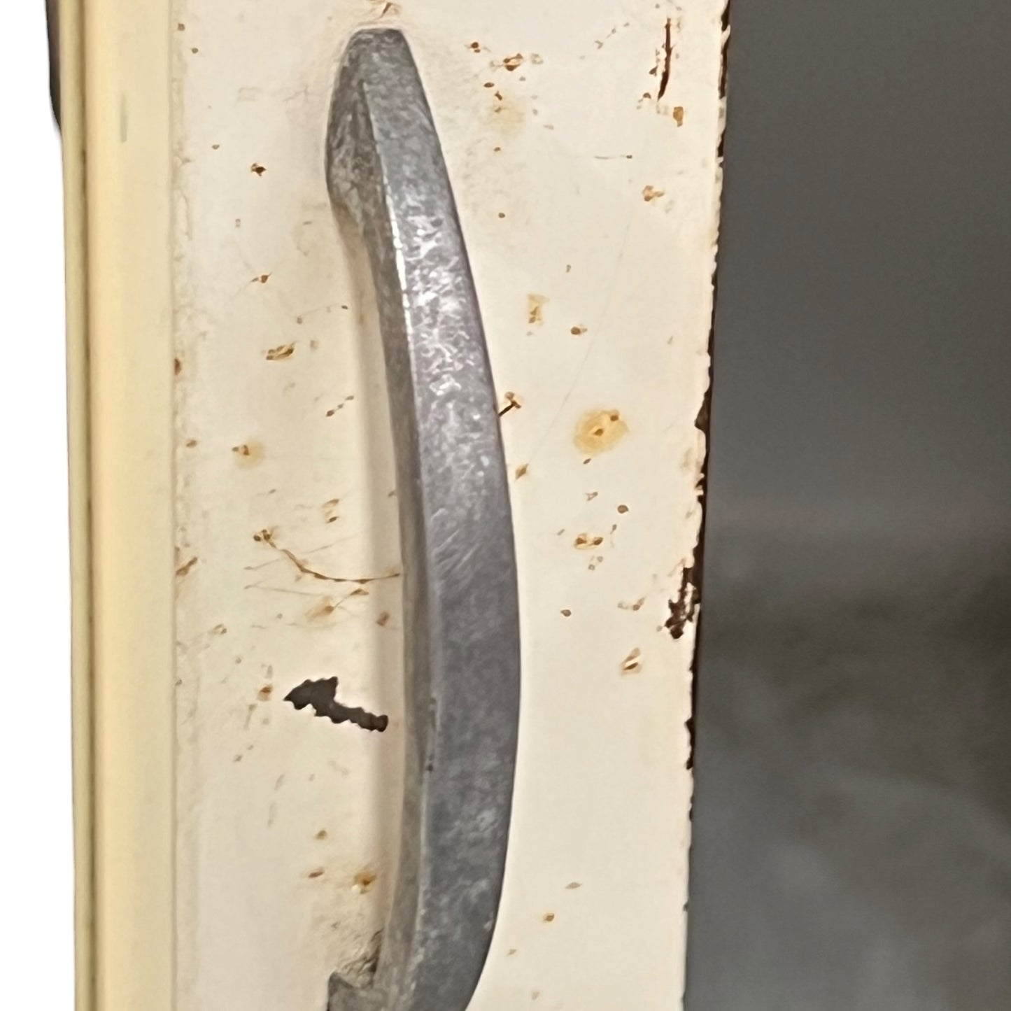 close up of a vintage metal bathroom cabinet
